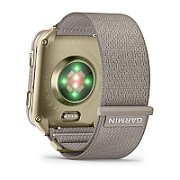 Smartwatch Garmin Venu® X1, Soft Gold cu spate din titan si curea din nailon French Gray